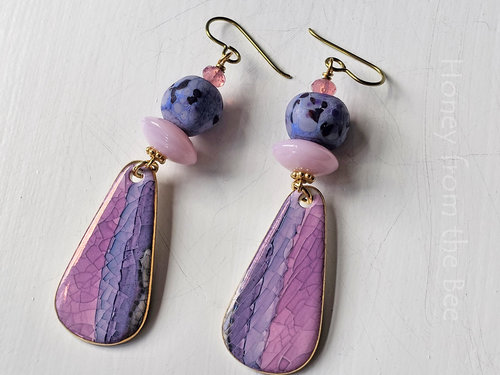 Ceramic drop earrings in pink and purple