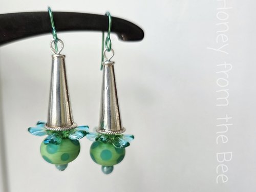 Green and aqua earrings feature sterling silver