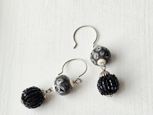 Statement earrings in black and white