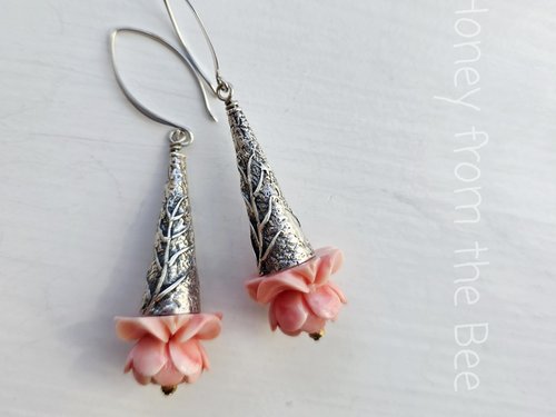 Flower Lover earrings feature pink flowers on sterling silver