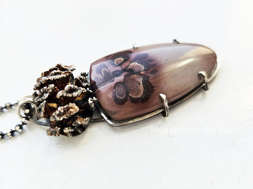 Cast sterling silver pinecone complements the Apache sage cabochon in this nature inspired pendant necklace