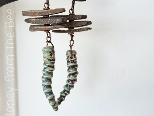 Green and brown earrings with quirky character