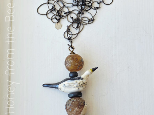 By the sea necklace features lampwork and sea pottery