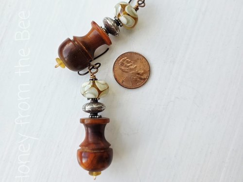 Statement earrings in brown and yellow