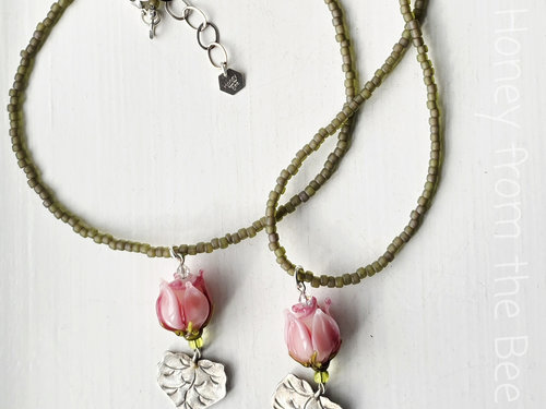 Lampwork necklace features pink rosebud and Thai silver leaf