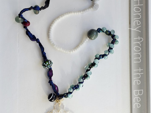 Boho style necklace in white, blue and teal