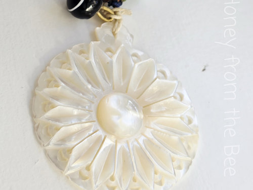 Carved Mother of Pearl pendant with lampwork and silk ribbon