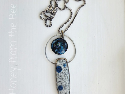 Outer space inspired pendant in blue and silver