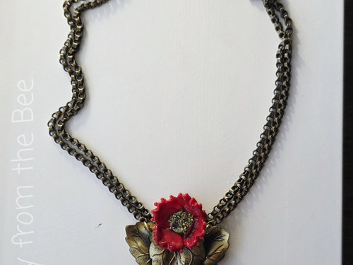 One of a kind necklace features red poppy