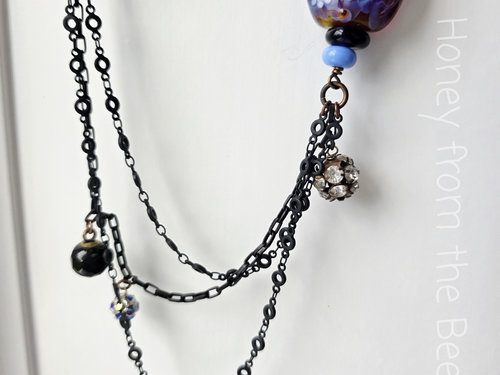 black charm chain with crow lampwork
