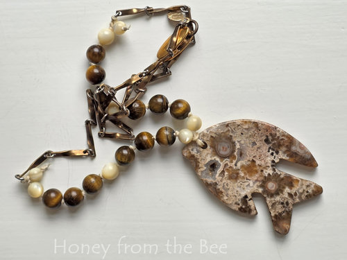 Art necklace features ocean jasper, tiger eye and mother of pearl