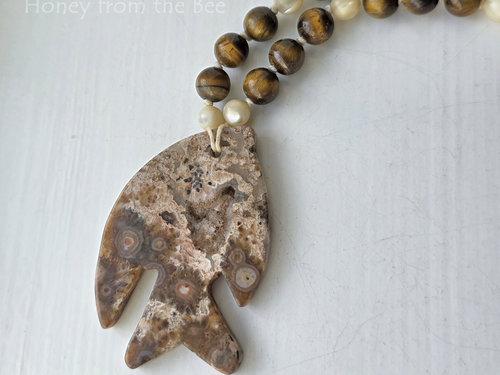 Fish necklace features ocean jasper and tiger eye in browns and white