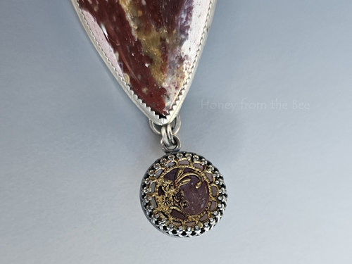 Antique mirror button in red and gold is set in sterling silver to be a dangle in this one of a kind artisan necklace.