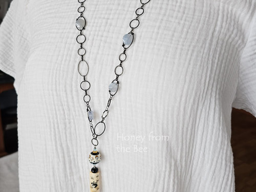 Tunic length artisan necklace on model