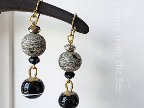 Dangle earrings in black and gold sparkle with crystals