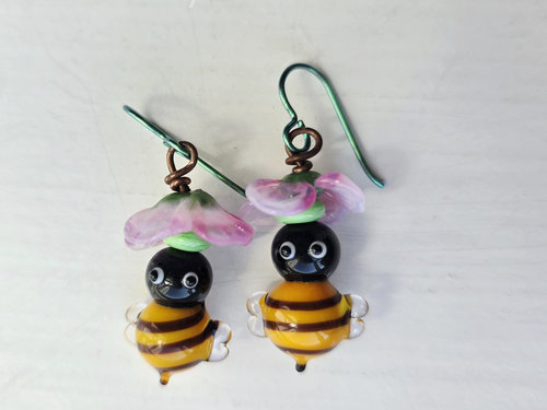 spring earrings featuring honeybees and pink flowers