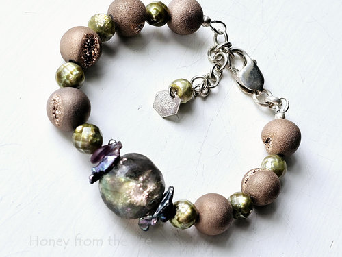 Pink and green bracelet features basha bead and pearls