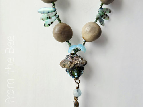 Beach necklace features tagua nuts and lampwork