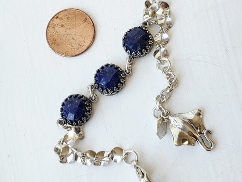 Silver and blue bracelet features lapis and sterling silver