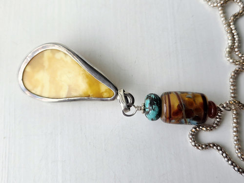 back of vintage amber pendant