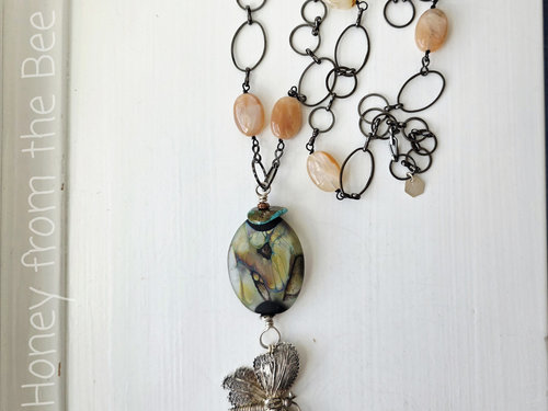 Turquoise and silver necklace with butterfly theme