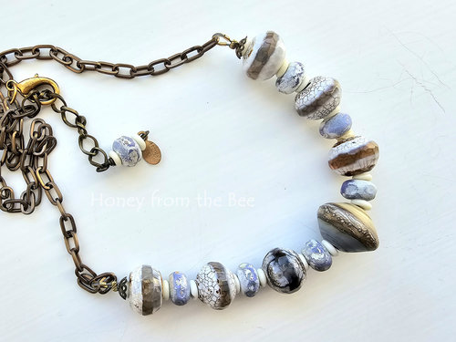 Beach necklace in shades of white, tan and lavender