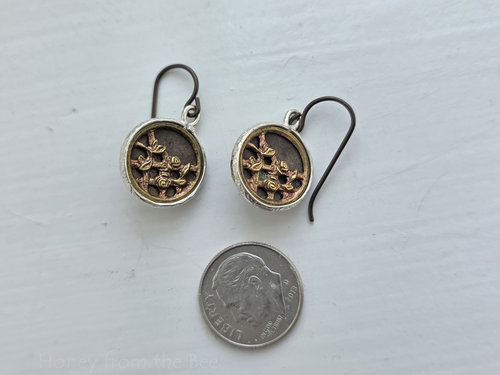 Petite button earrings feature antique brass buttons from the Victorian era