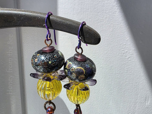 Bead earrings in purple and yellow feature lampwork and vintage lucite