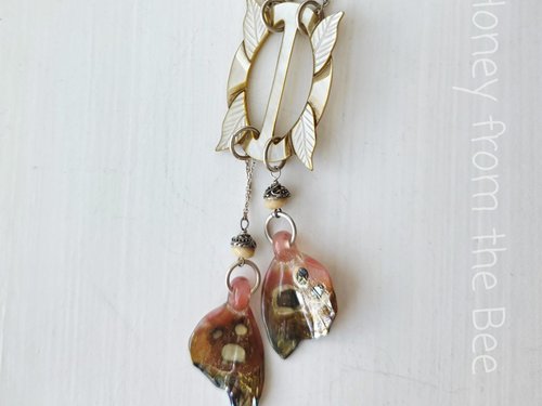 Boho style necklace with antique mother of pearl focal and butterfly wings in artisan glass