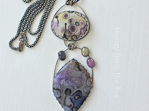 Art necklace in colorful shades of blue, purple, pink and yellow