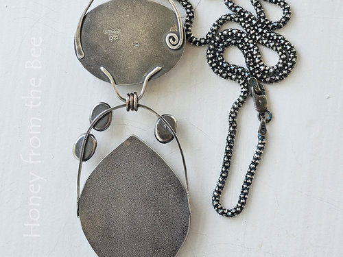 Photo shows back of sterling silver gemstone pendant