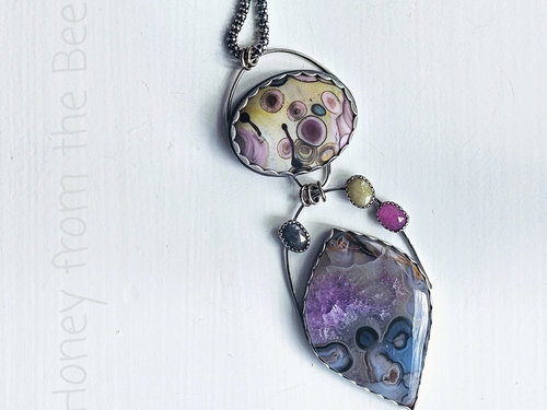 Colorful Statement necklace features agate, art glass and sapphires in blue, purple, pink and yellow.