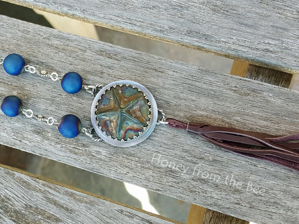 Star necklace with ceramic focal and blue beads with leather tassel
