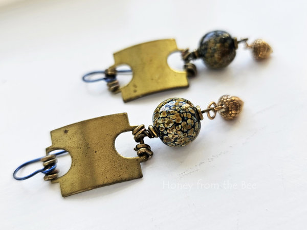 Brass and art glass earrings feature vintage brass tag with raku frit lampwork bead and a detailed brass acorn dangle.