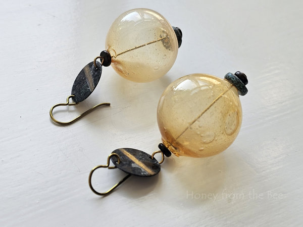 Golden yellow earrings with verdigris brass