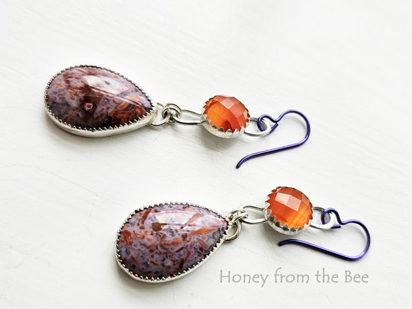 Lavender and orange gemstone drop below faceted orange gemstone earrings
