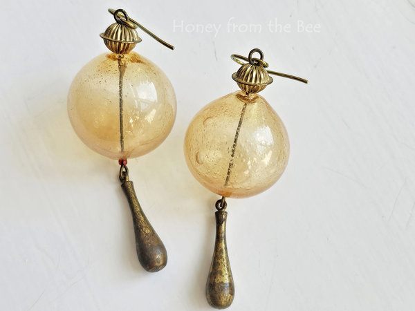 Yellow hollow bead earrings with aged brass drops