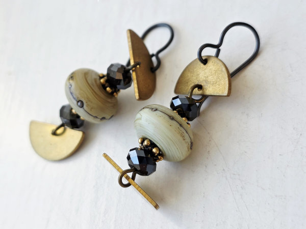Cream and gold earrings with black