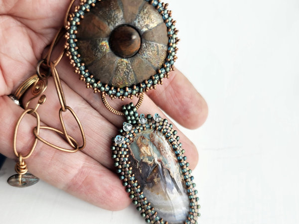 One of a kind art pendant features Prudent Man Plume Agate from Idaho, ceramic cabochon and bead embroidery