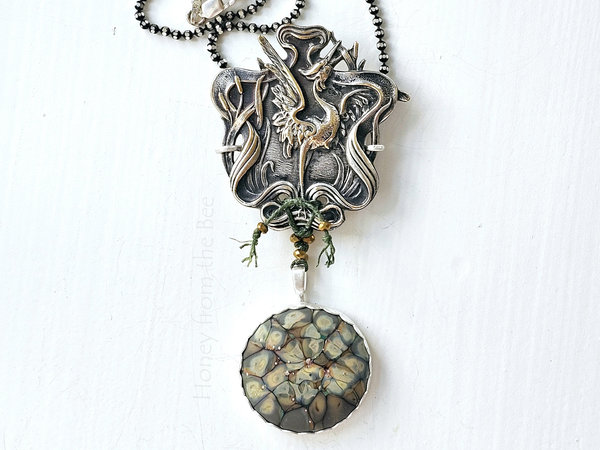 Art Nouveau style pendant with crane image and art glass dangle