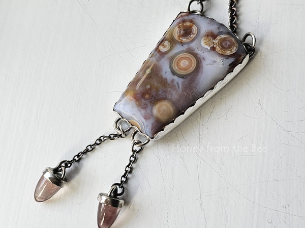 One of a kind artisan necklace features high quality ocean jasper and sunstones set in sterling silver