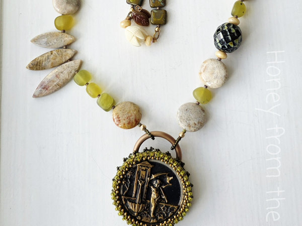 Garden theme necklace in green, cream and gold