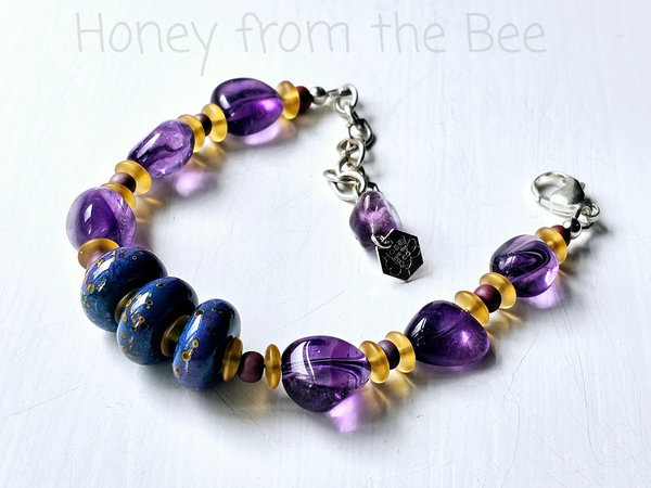 Amethyst and lampwork bracelet in shades of purple, teal and yellow