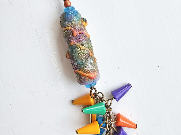 Colorful lampwork necklace with a multi-color fringe
