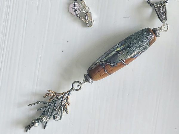 Nature inspired pendant in terra cotta and silver