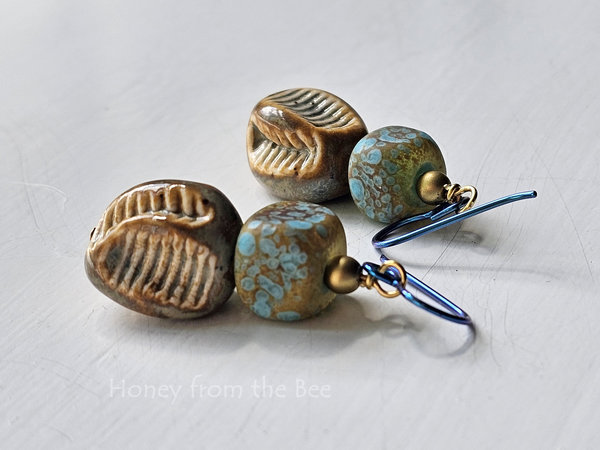 Tan and Aqua lampwork earrings with ceramic pinch bead