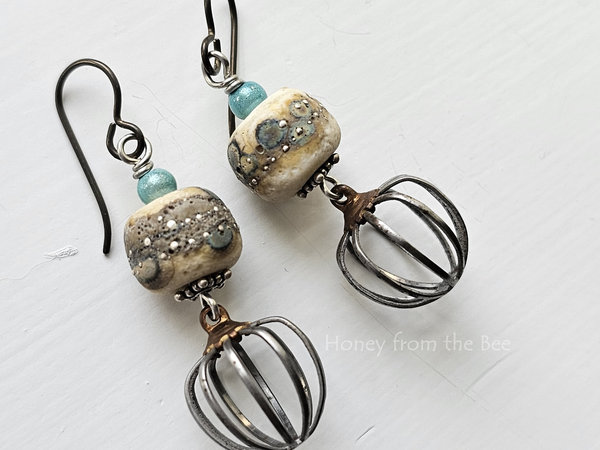 Raku lampwork earrings in shades of cream, teal and silver