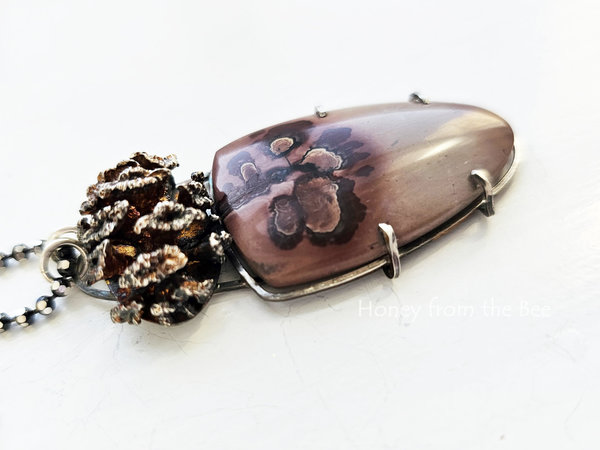Cast sterling silver pinecone complements the Apache sage cabochon in this nature inspired pendant necklace