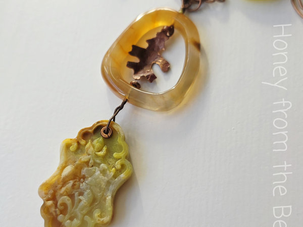 Nature inspired necklace features copper oak leaf and yellow opal
