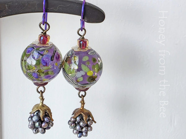 Summer earrings feature berry dangle and lampwork in purple and green